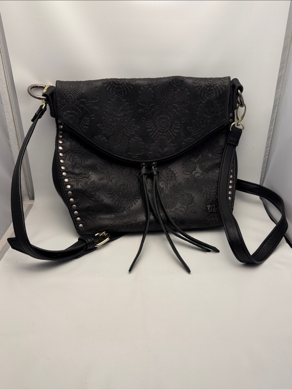 The Sak Black Embossed Leather Crossbody with Studs & Tassels
